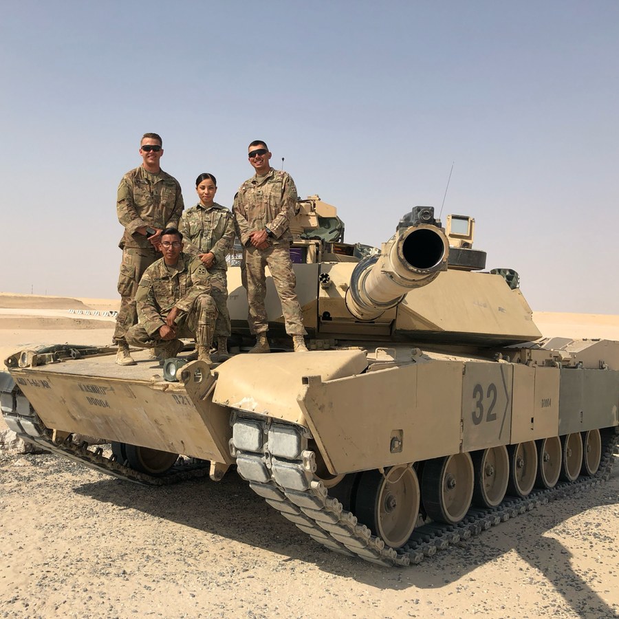 Pierce with his tank crew on an Abrams tank