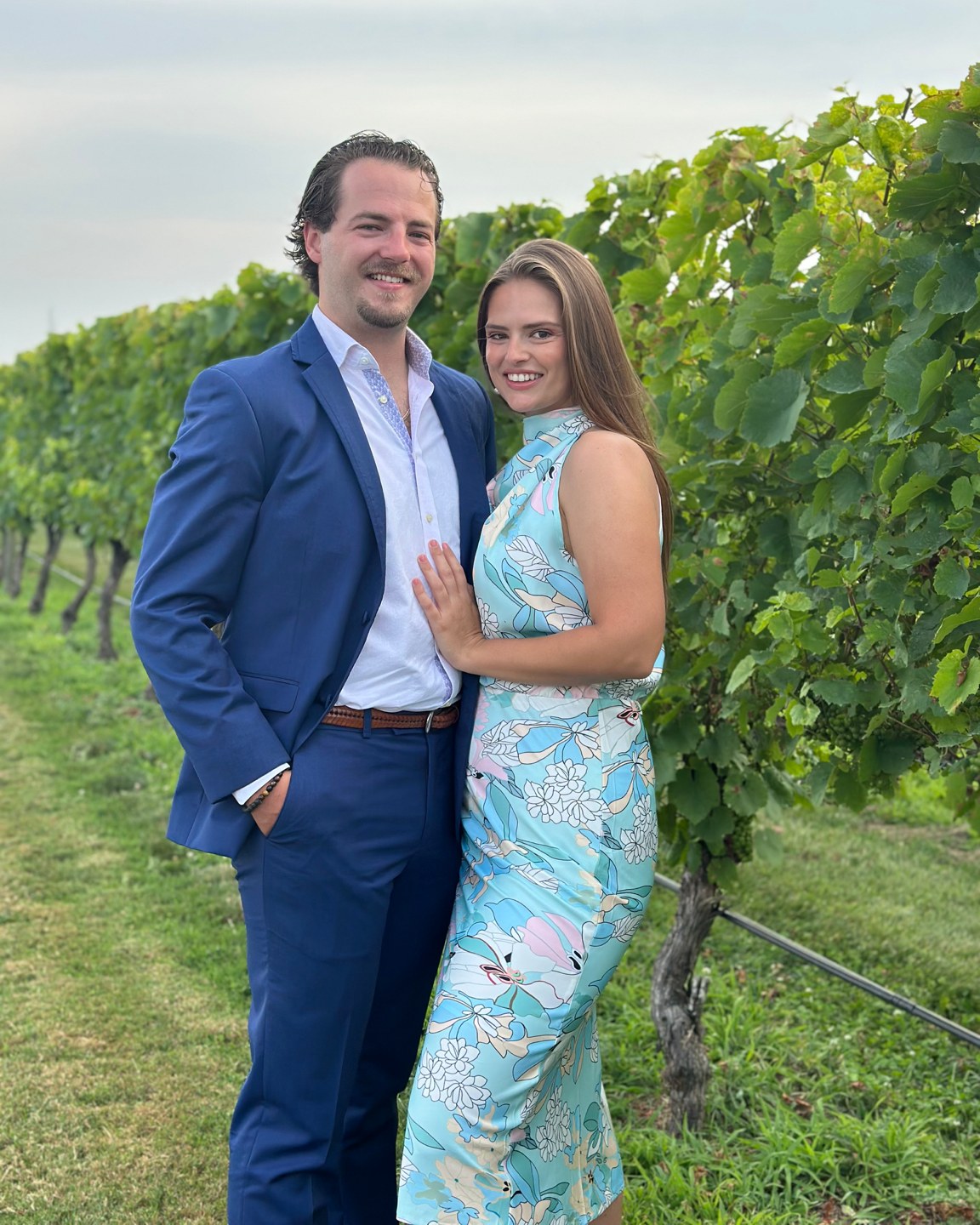 Pierce and his fianc&eacute;e, Carly, at a vineyard